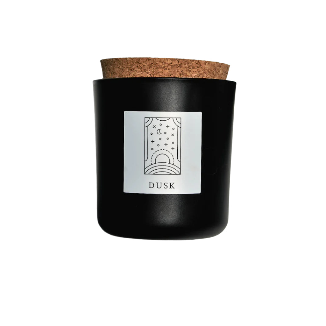 Dusk candle in black apothecary glass with cork top for wholesale through Faire, Bulletin, Shoppe Object, and directly.