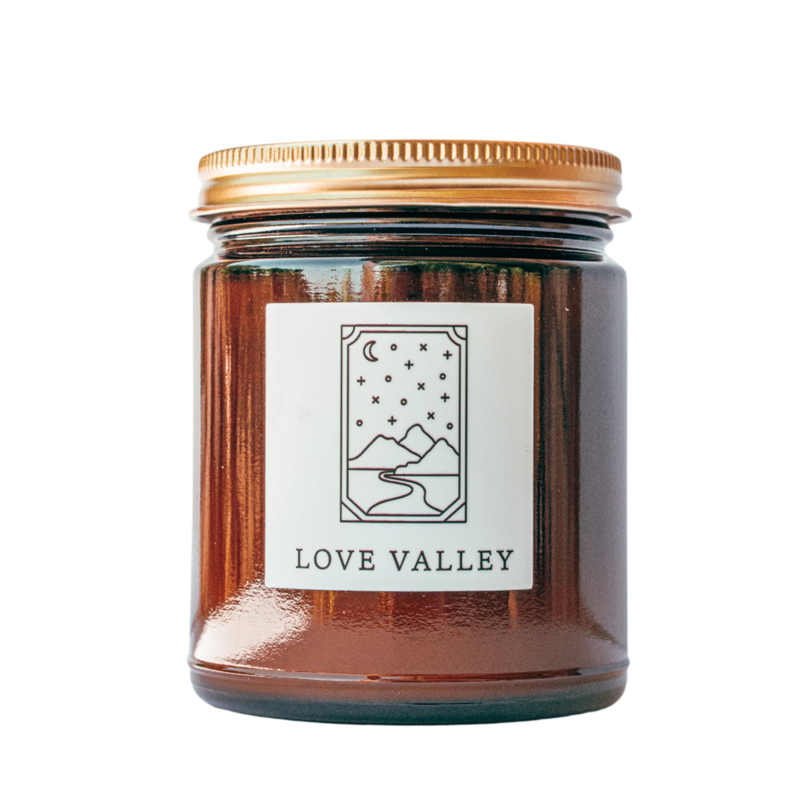 Love Valley candle in amber jar with gold lid for wholesale through Faire, Bulletin, Shoppe Object, and directly.