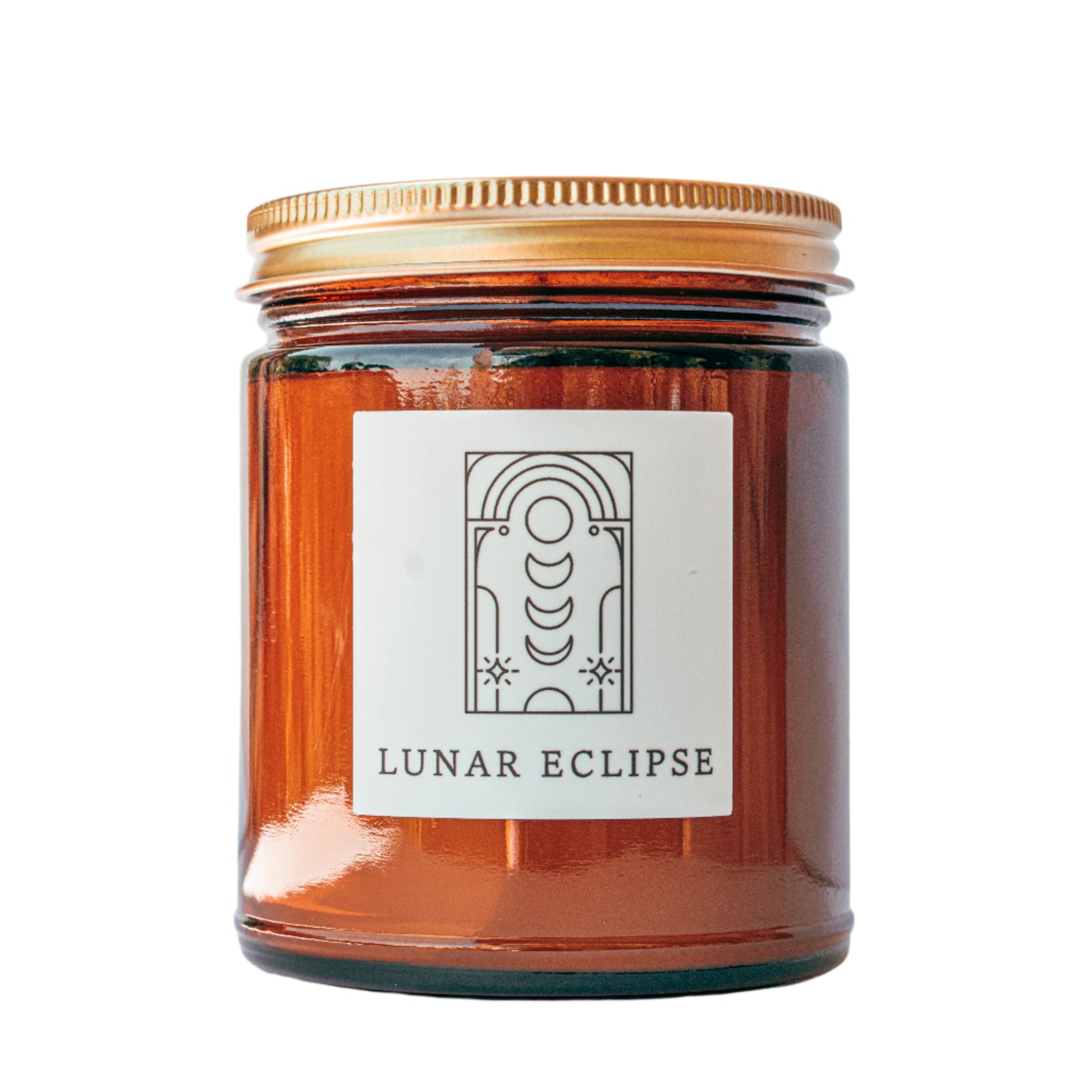 Lunar Eclipse candle in amber jar with gold lid for wholesale through Faire, Bulletin, Shoppe Object, and directly.