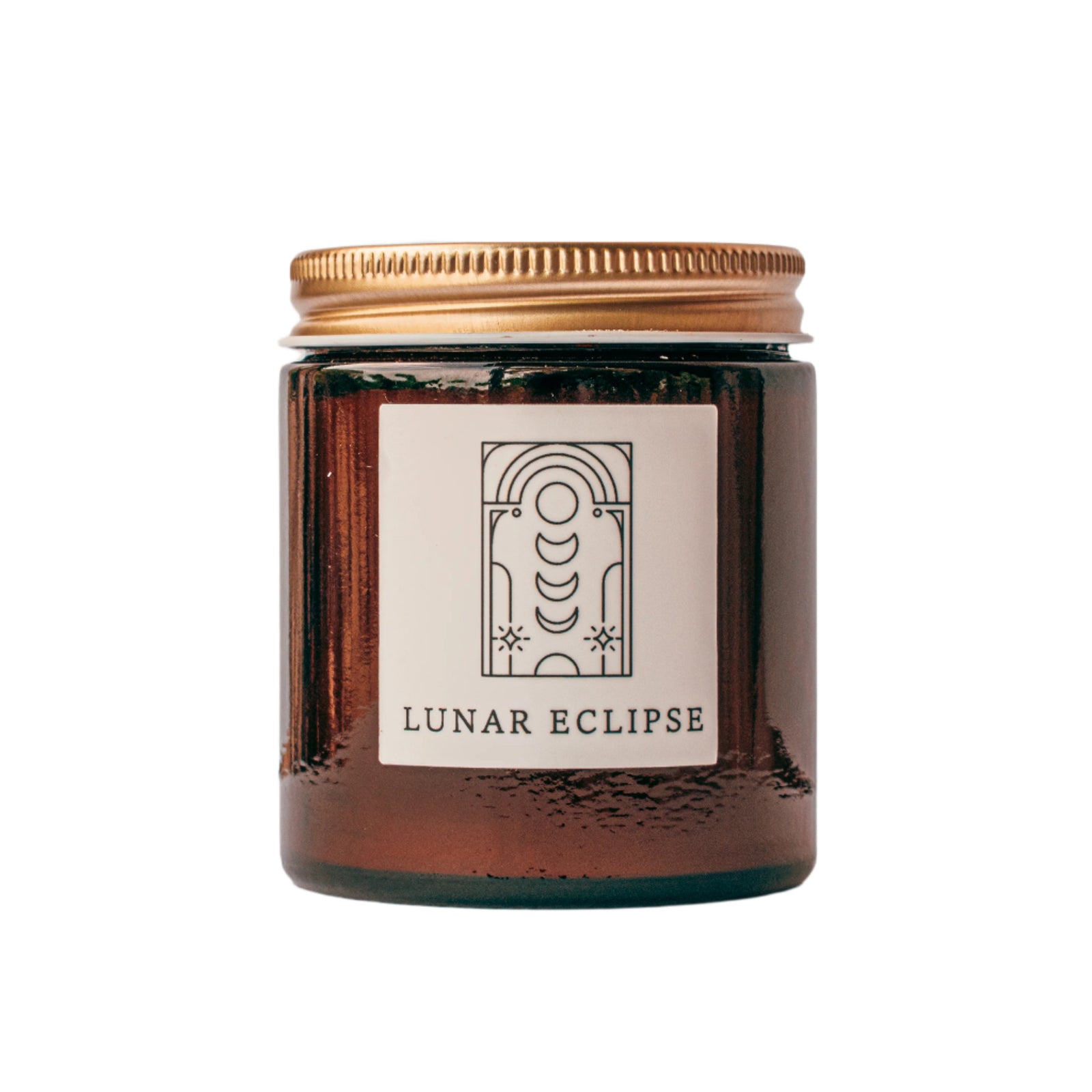 Lunar Eclipse candle in amber jar with gold lid for wholesale through Faire, Bulletin, Shoppe Object, and directly.