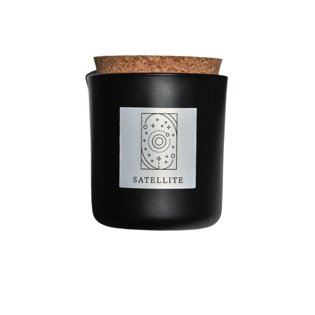 Satellite candle in black apothecary glass with cork top for wholesale through Faire, Bulletin, Shoppe Object, and directly.