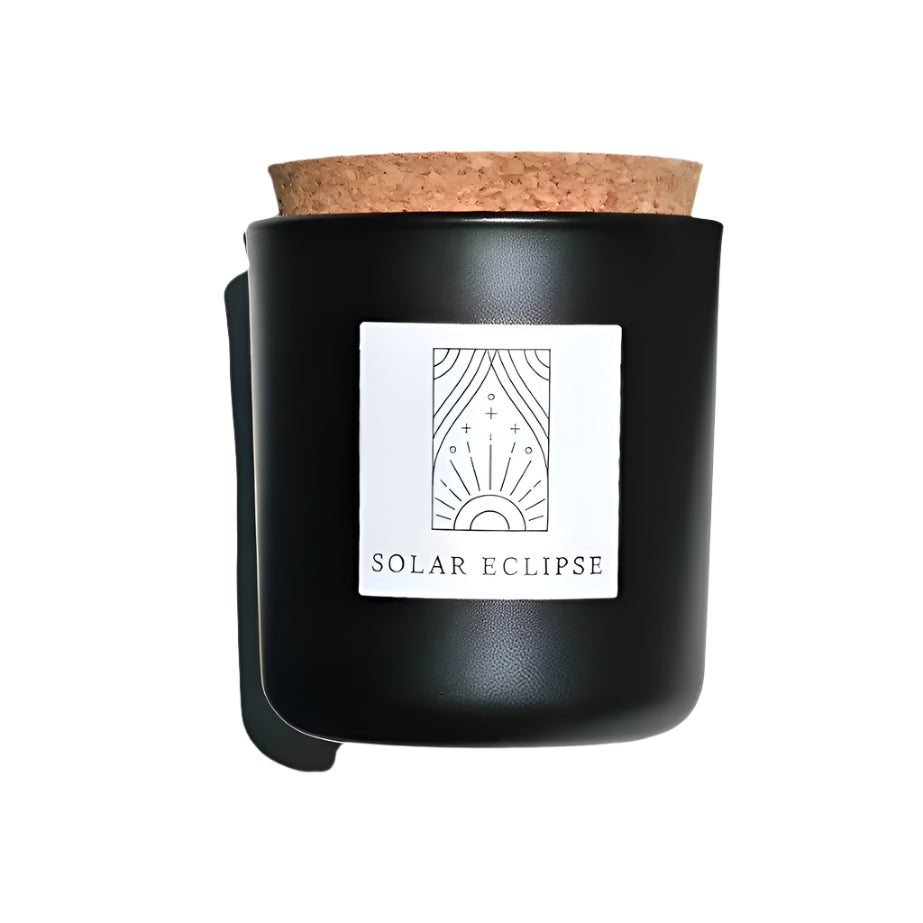 Solar Eclipse candle in black apothecary glass with cork top for wholesale through Faire, Bulletin, Shoppe Object, and directly.