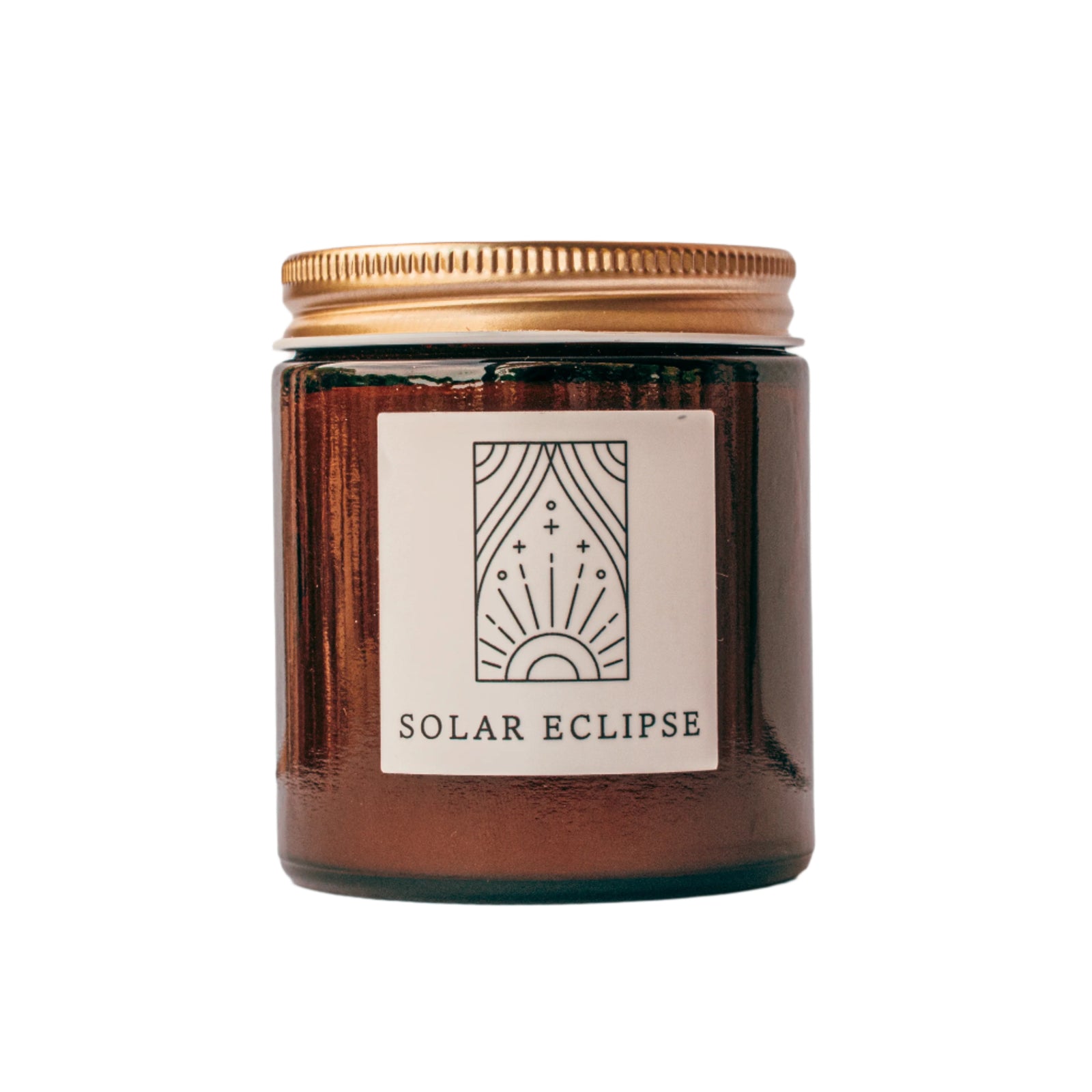 Solar Eclipse candle in amber jar with gold lid for wholesale through Faire, Bulletin, Shoppe Object, and directly.