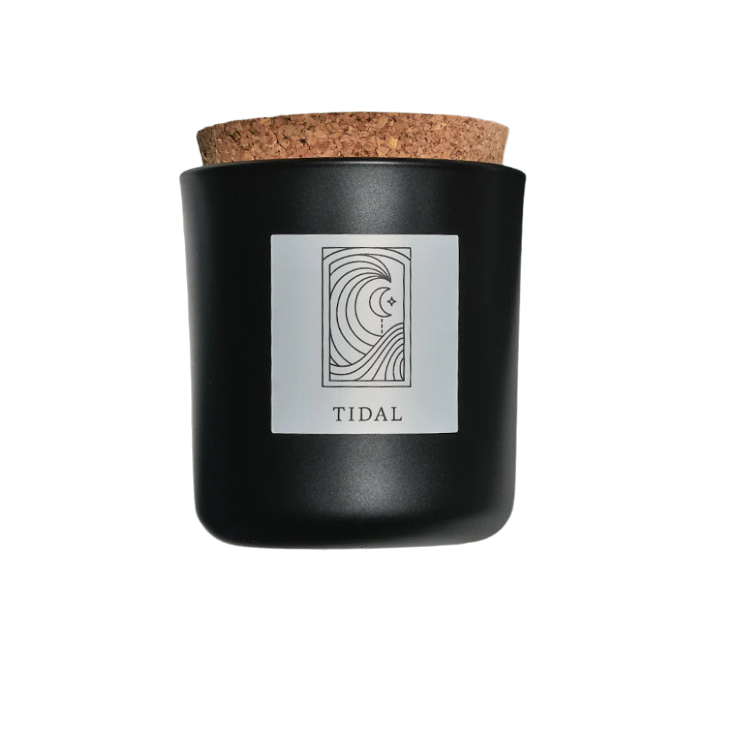 Tidal candle in black apothecary glass with cork top for wholesale through Faire, Bulletin, Shoppe Object, and directly.